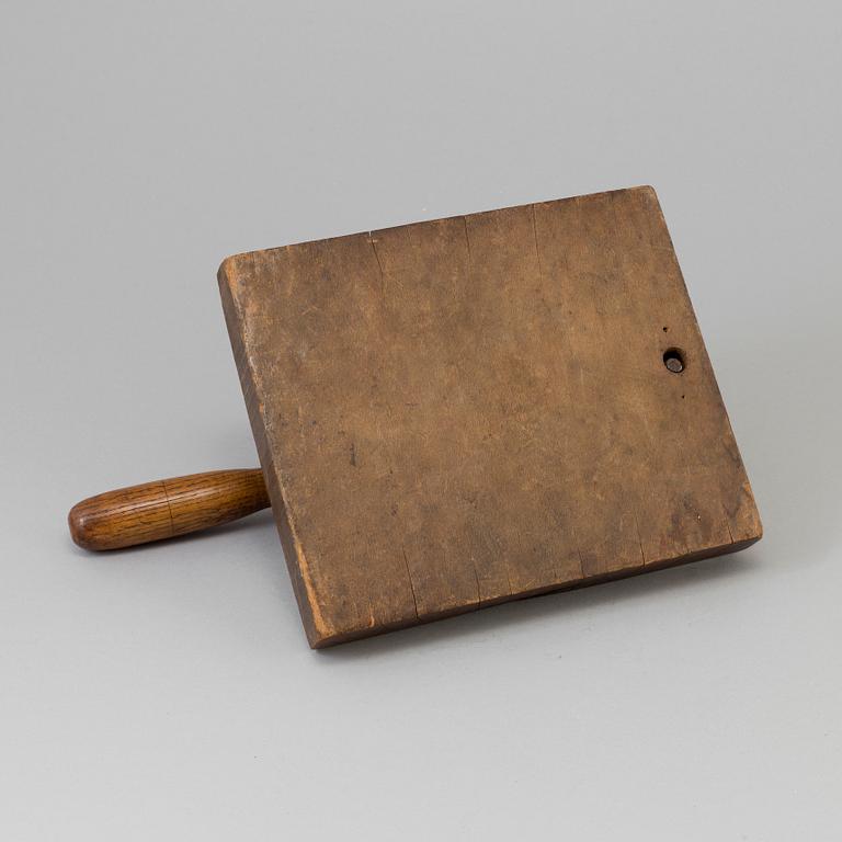 A 19TH CENTURY TOBACCO CUTTER, wood and iron.