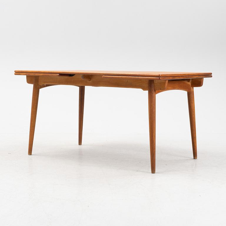 Hans J Wegner, a model 'AT-312' teak veneered dining table, Andreas Tuck, Denmark.