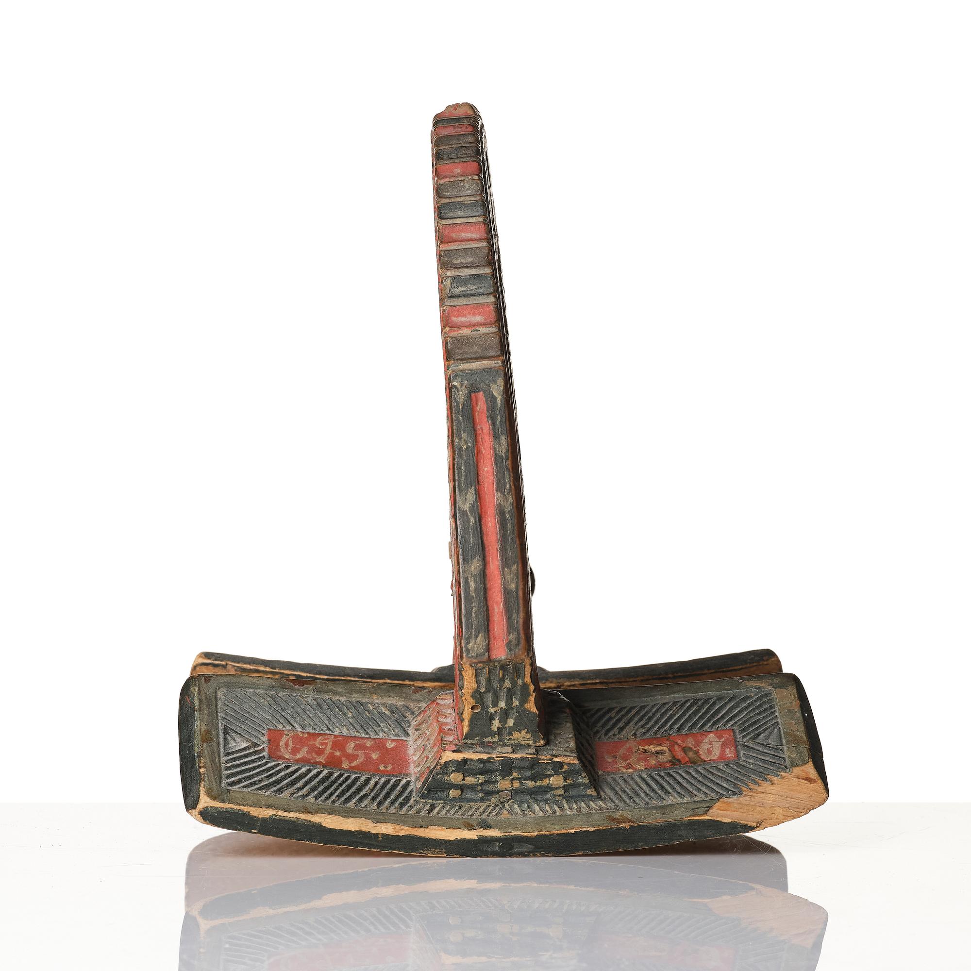 A Swedish folk art carved and polychrome-painted part horse harness, Uppland, dated 1774.