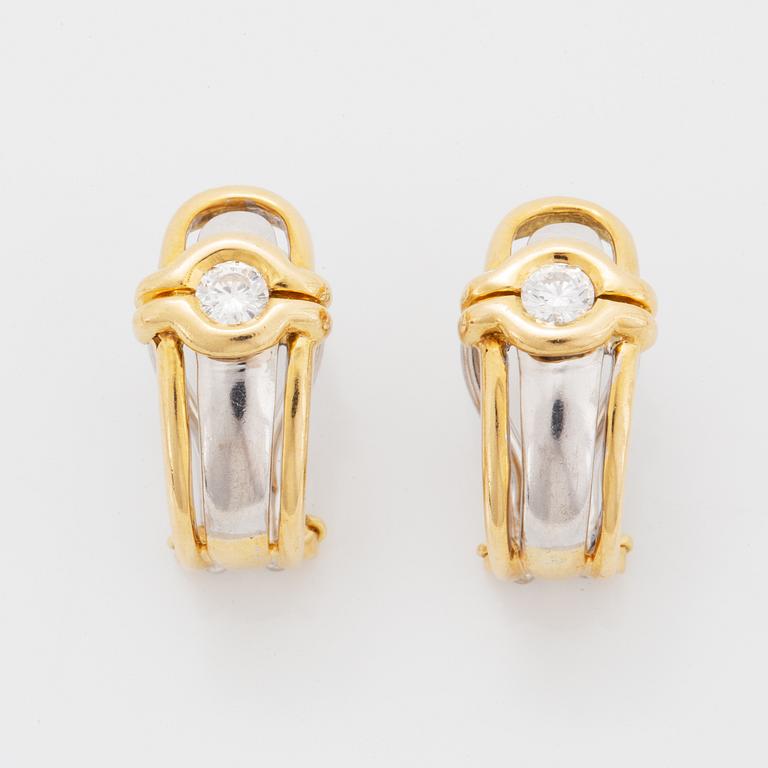 A pair of 18K gold earrings.