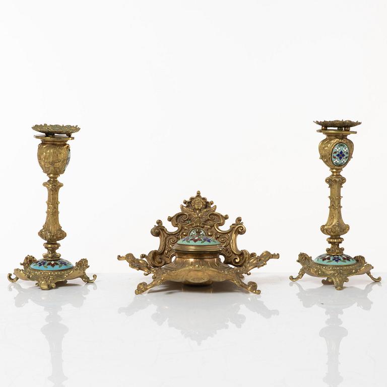 A pair candlesticks and an inkwell, circa 1900.