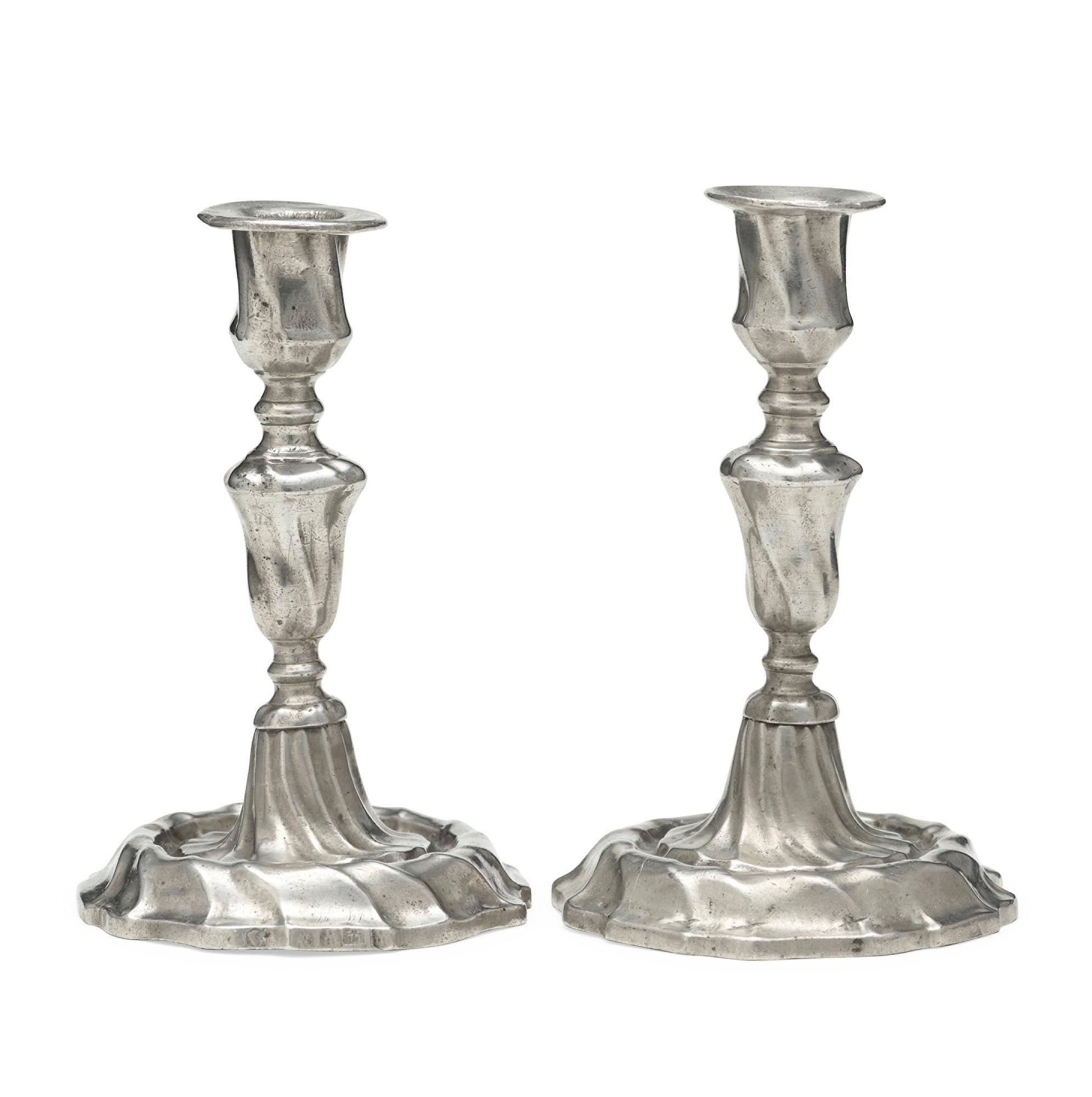 A pair of Swedish Rococo pewter candlesticks by L Lundwall 1762.