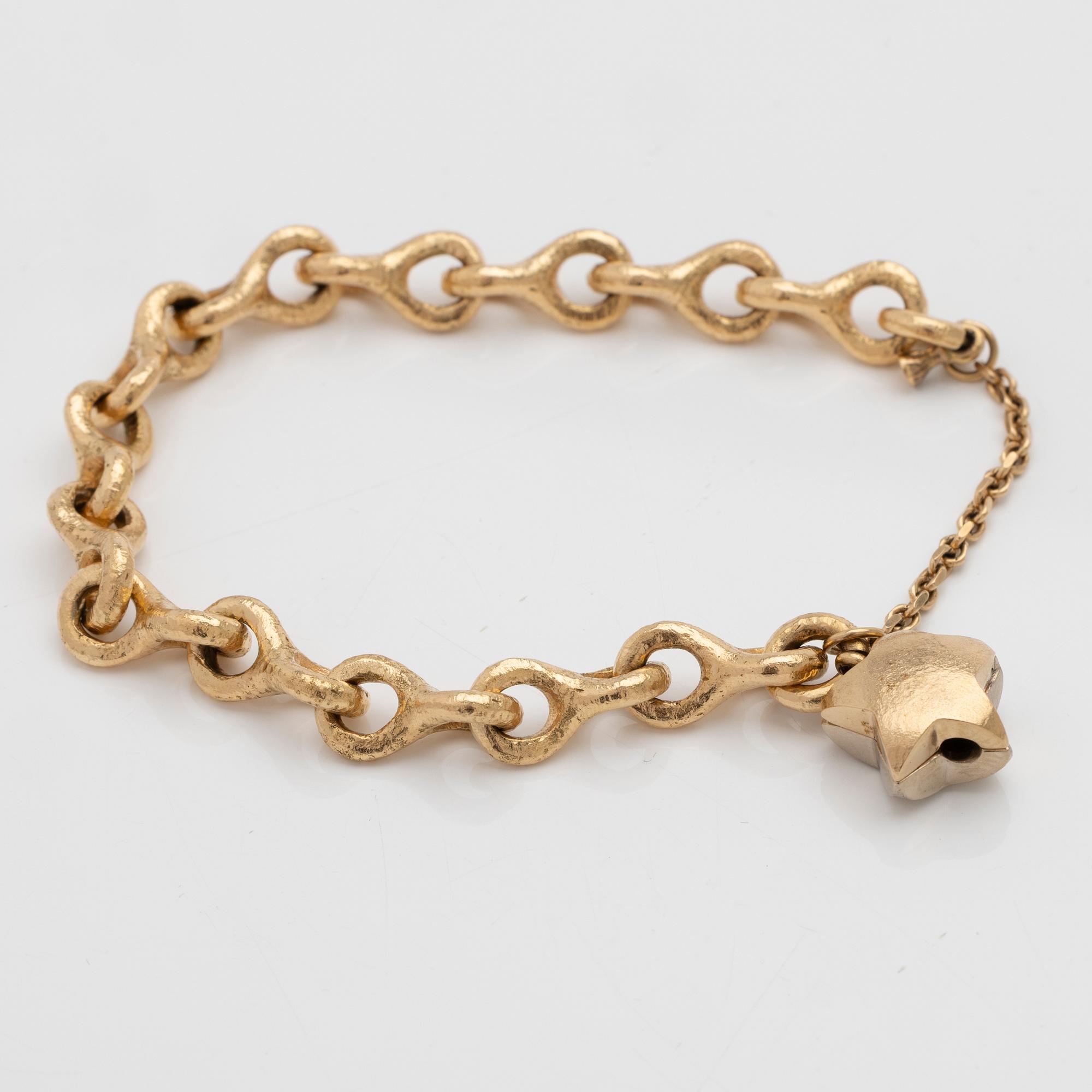 Armband 18K guld med en diamant.