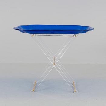 A plastic tray table, probably from Spisani, Italy.