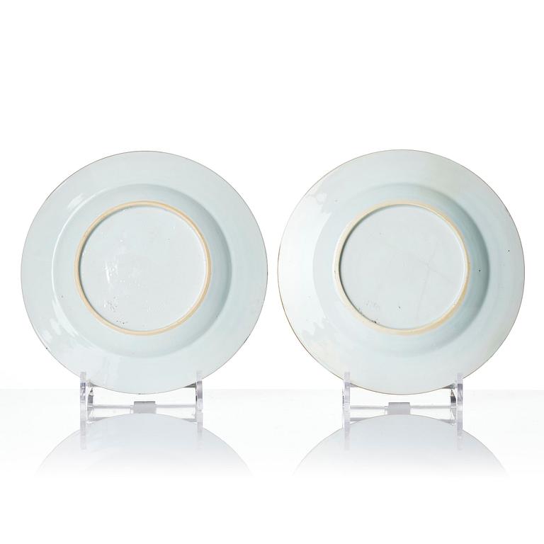 A pair of iron red decorated armorial dishes, Qing dynasty, 18th century.