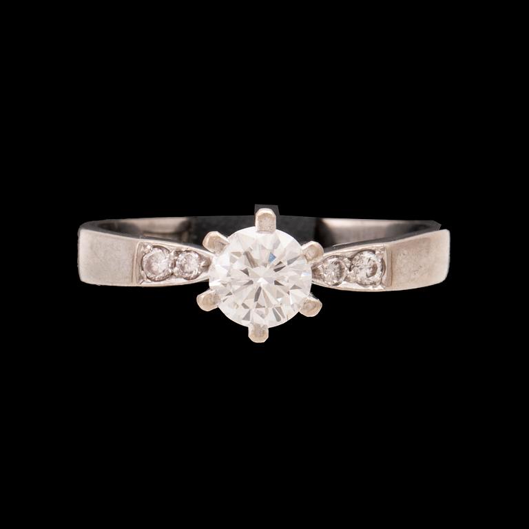 An 18K white gold ring set with round brilliant cut diamonds by Lundberg Guldatelje Amie Stockholm 1977.