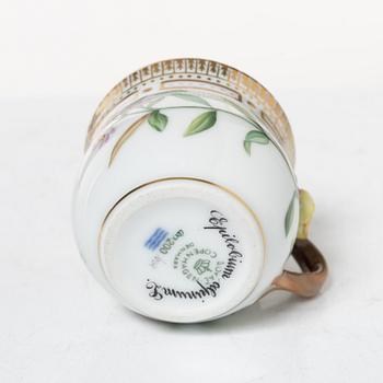 Royal Copenhagen, cream jug with lid and saucer, as well as coffee cup with saucer, porcelain, Flora Danica, Denmark.