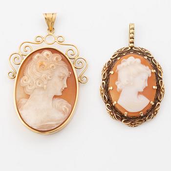 Two gold and shell cameo pendants.
