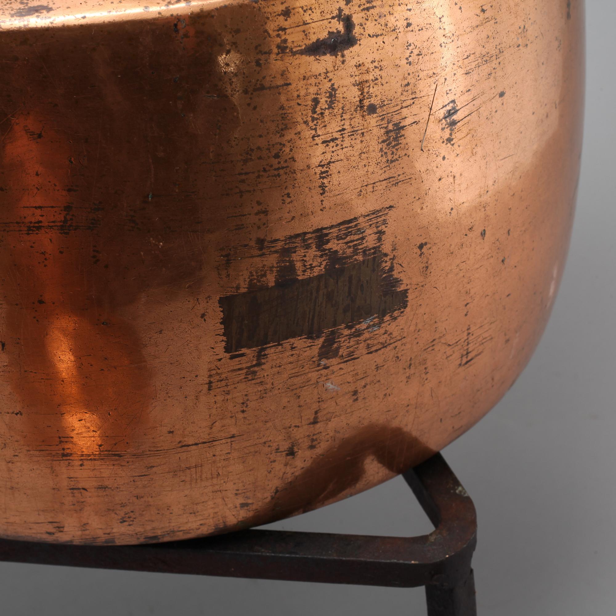 A coffee pot and a ladle in copper from the 19th century.