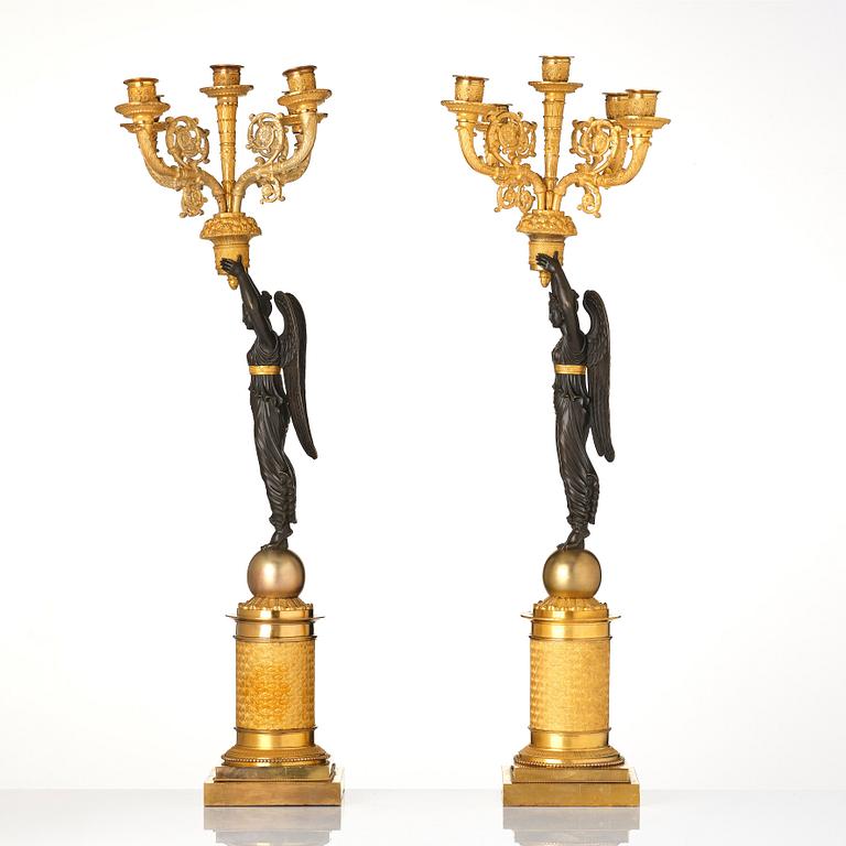 A pair of French Empire five-light candelabra, attributed to Francois Rabiat (bronze maker in Paris 1756-1815).