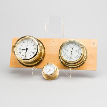 TWO BRASS MARINE CLOCK AND A BAROMETER BY STOCKBURGER.