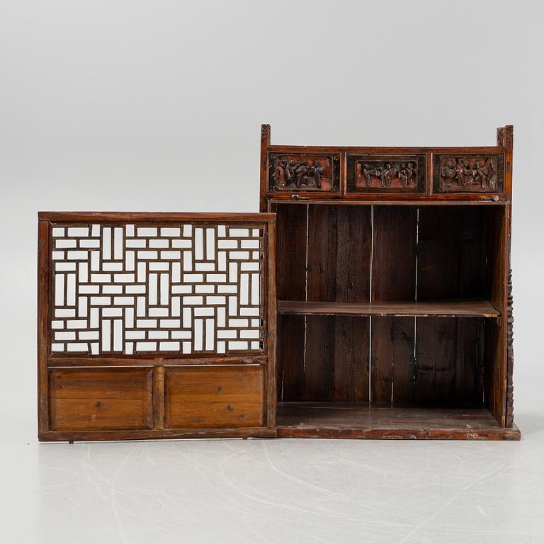 A cabinet, China, 20th century with older parts.