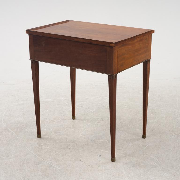 A late Gustavian mahogany writing table from araound the year 1800.