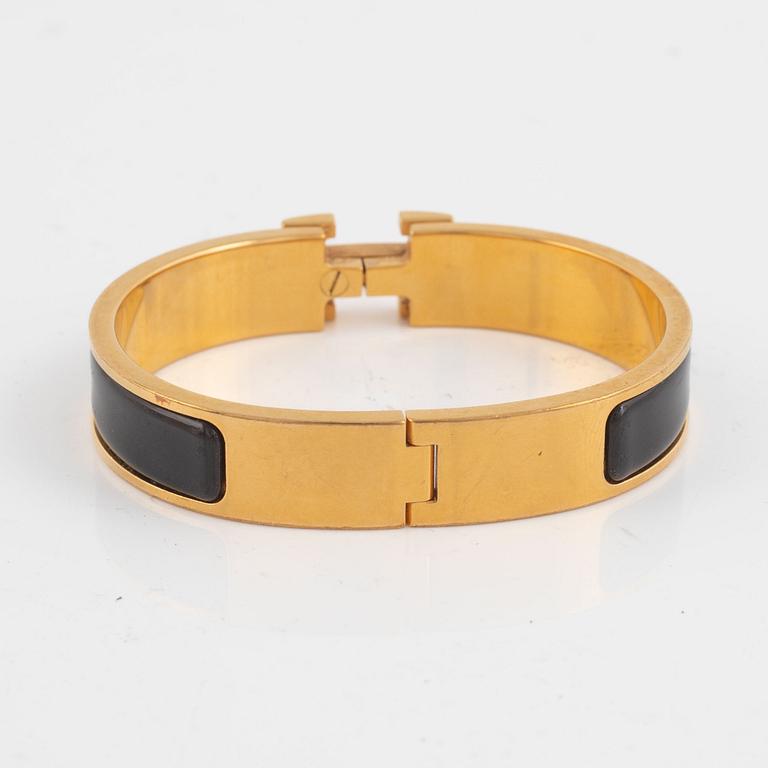 Hermès, a 'Clic H' bracelet.