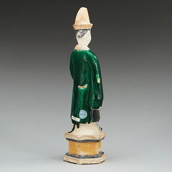 A green and yellow glazed potted figure of a Dignitary, Ming dynasty (1368-1644).