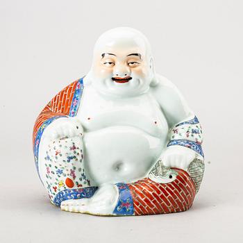 A Chinese porcelain buddha, 20th century.