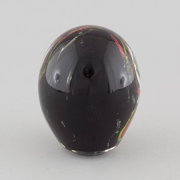 a glass object, signed.