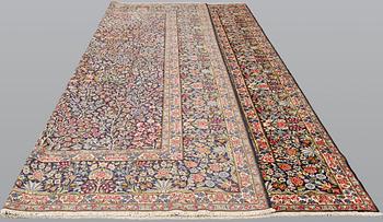 A Kirman Laver carpet, 'Millefleur', approx. 400 x 295 cm.