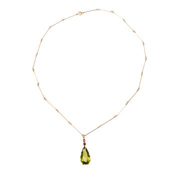 Ateljé Stigbert, necklace in 18K gold with a pear-shaped peridot and faceted rubies, Heribert Engelbert Stockholm 1948.