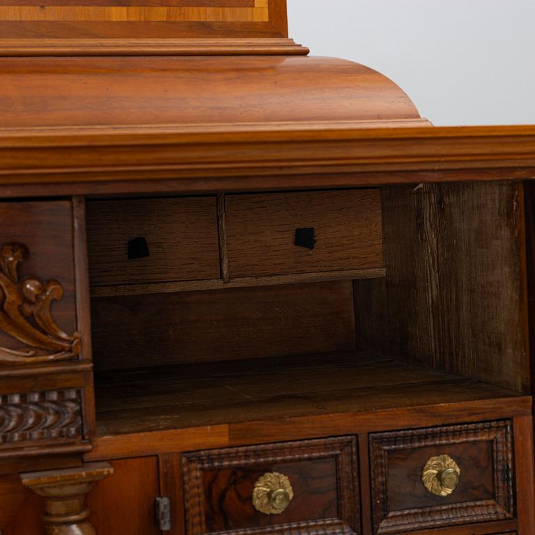 A Baroque style cabinet, circa 1900.