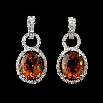 148. A pair of citrine and diamond earrings.