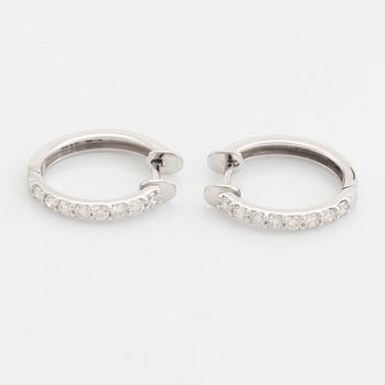 Brilliant cut diamond hoop earrings.
