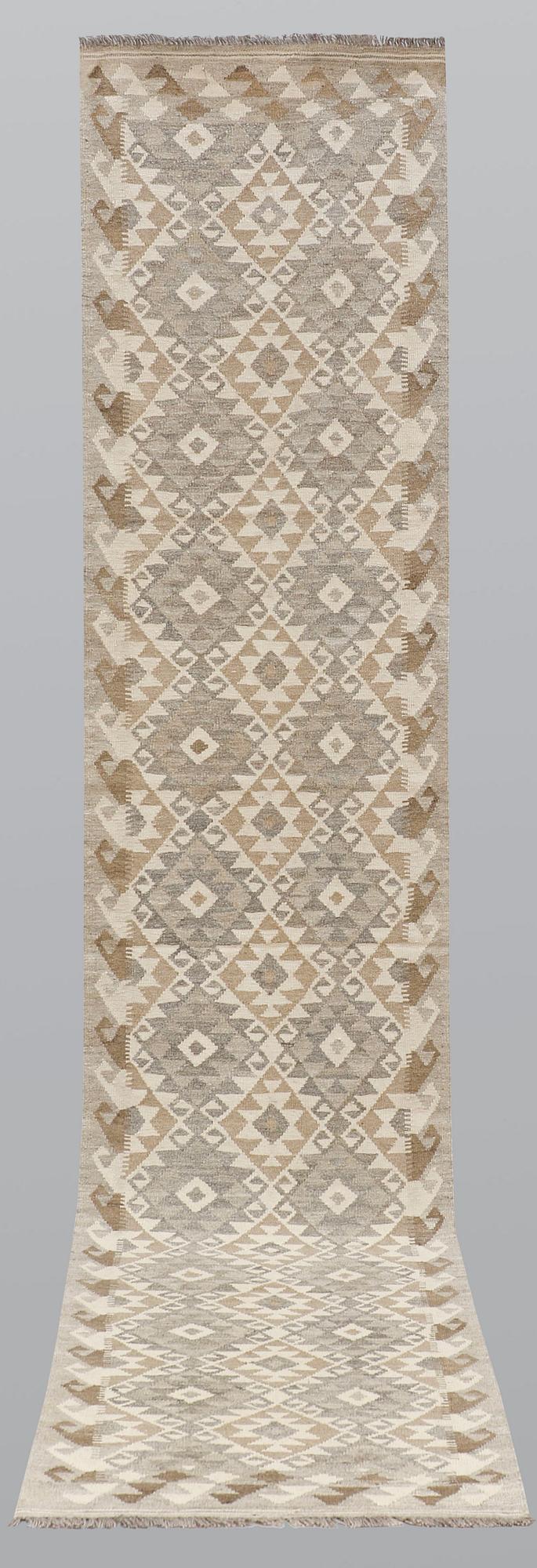 A runner, kilim, ca 387 x 79 cm.