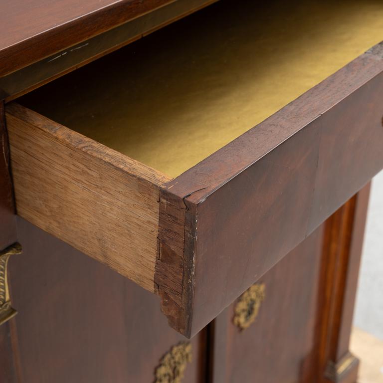 An Empire cabinet, first half of the 20th Century.