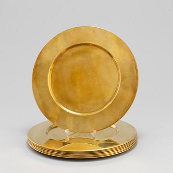 Eight brass plates by Stelton, Denmark, second half of the 20th century.