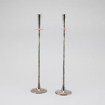 A pair of silver candelsticks by Tore Eldh, K&EX, Gothenburg, 1962.