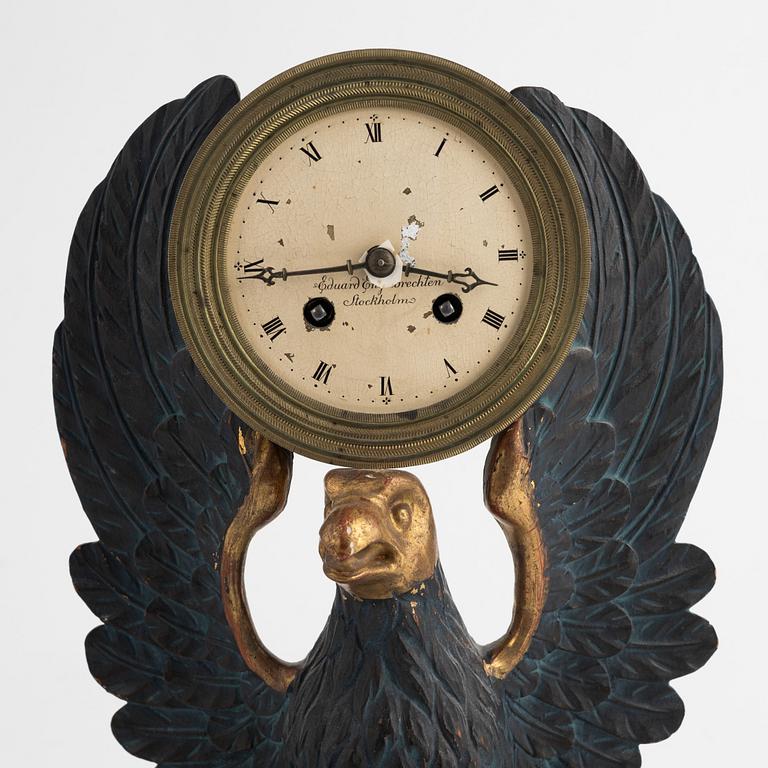 A Swedish Empire giltwood mantel clock by E. Engelbrechten (watchmaker active in Stockholm 1815-45).