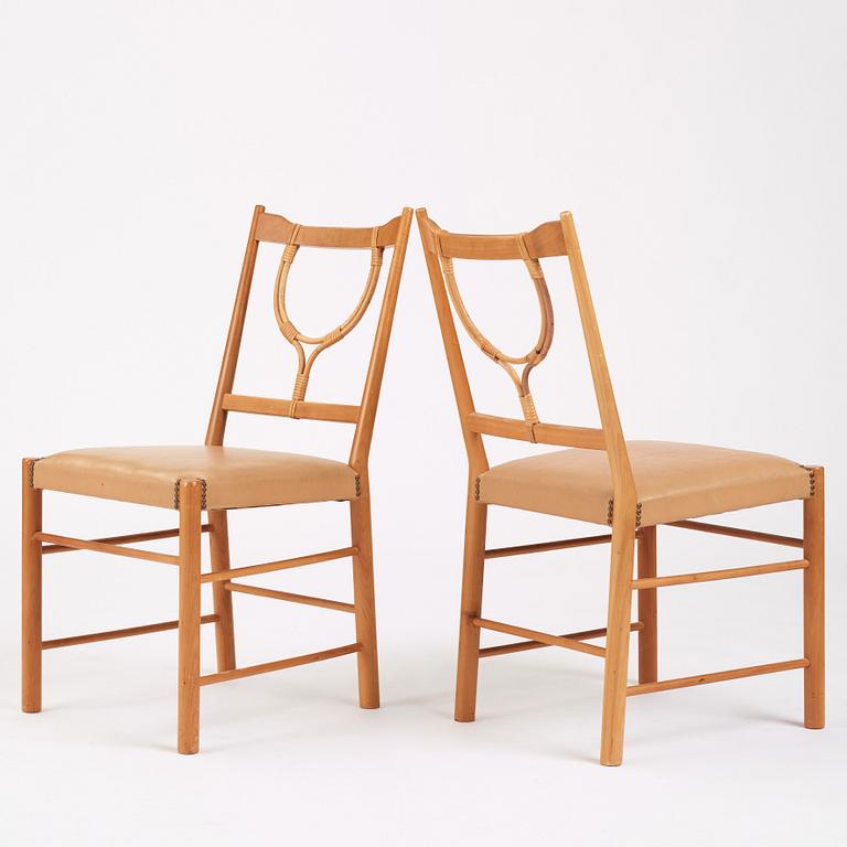 Josef Frank, a set of four cherry wood chairs, Svenskt Tenn, Sweden 1950s-1960s, model 2238.