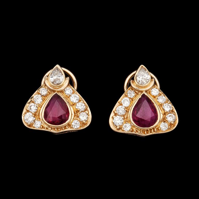 A pair of ruby, tot. ca 2 ct and diamond, tot. ca 0.90 ct earrings.