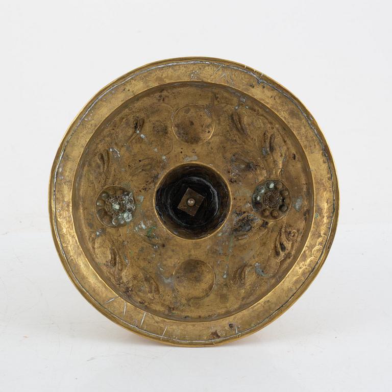 A Swedish repousse-brass baroque candlestick, circa 1700.