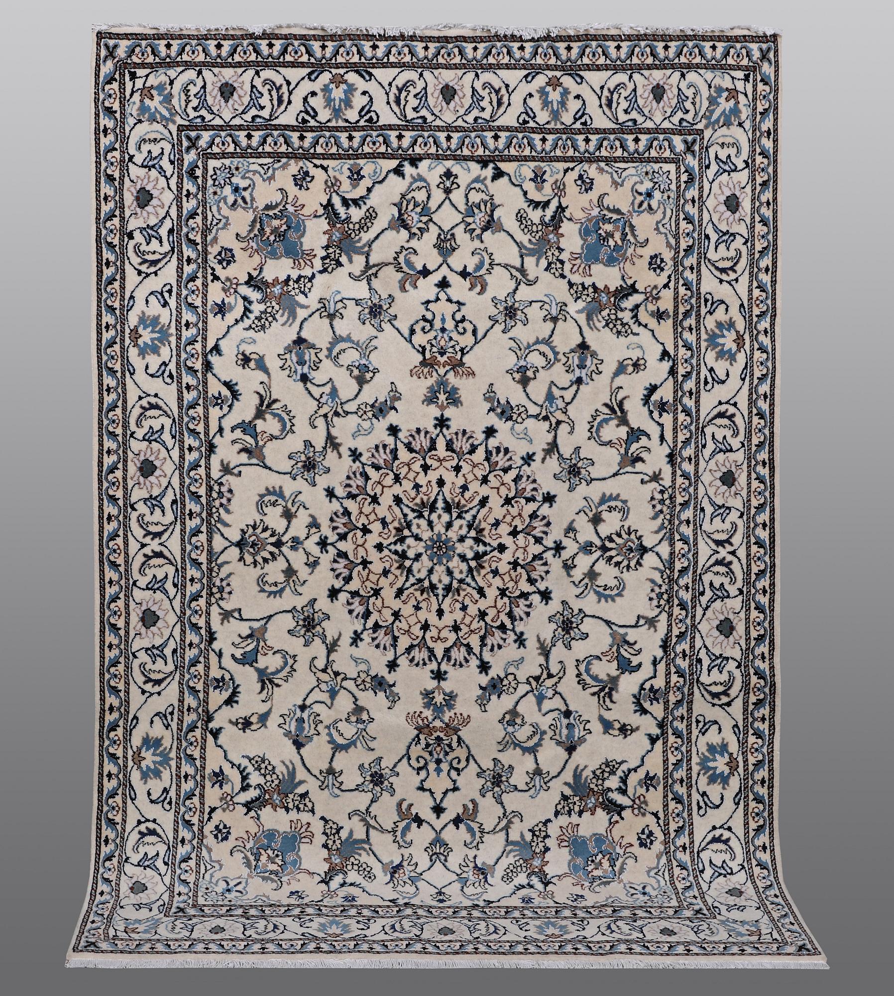 A rug, Nain, part silk, 238 x 163 cm.