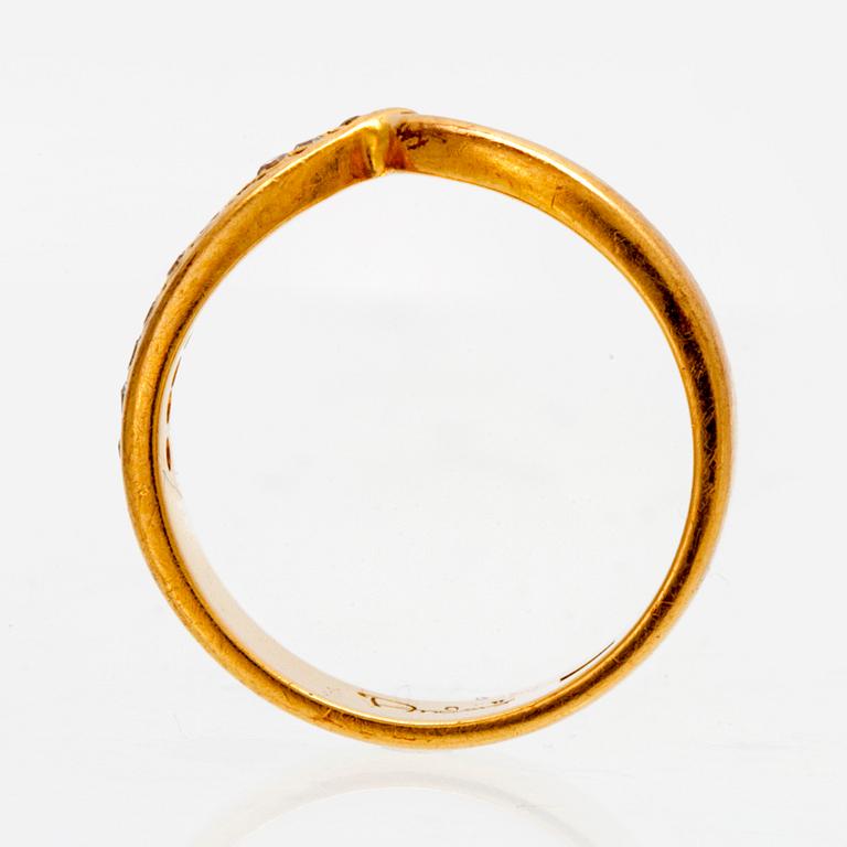 An 18K gold ring with octagonal cut diamonds.