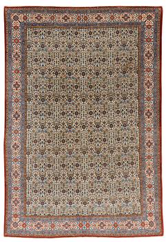 A carpet, semi-antique, Qum, ca 324 x 221 cm.