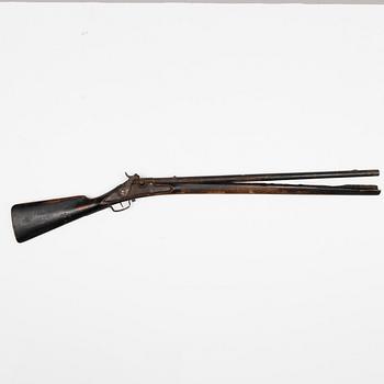 A mid 19th century caplock and matchlock shot gun.