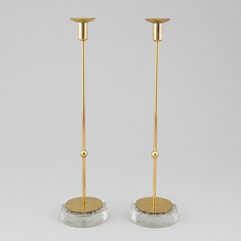GUNNAR ANDER, A pair of Ystad metall brass candlesticks.