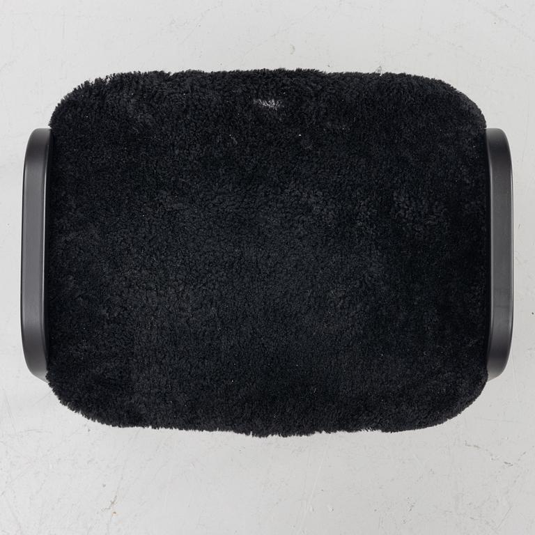 Yngve Ekström, a 'Lamino' easy chair with footstool, Swedese, 2018.