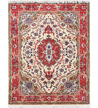 A Tabriz carpet, part silk, 50 raj, c. 204 x 154 cm.