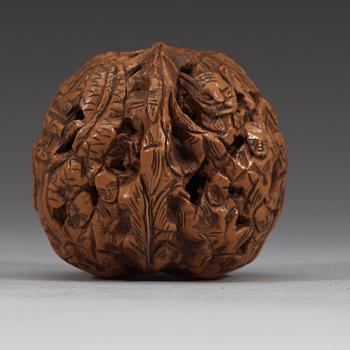 A set of six carved walnut hand exercisers, late Qing dynasty (1644-1912).