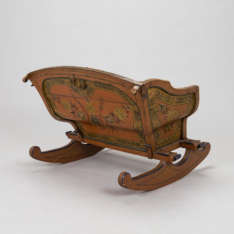 A 19th-century wooden sleigh.