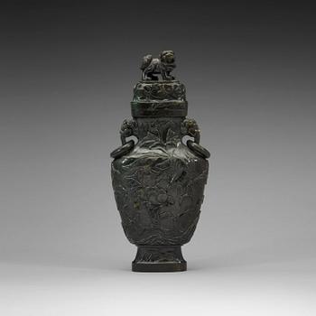 86. A Chinese carved stone vase, 20th Century.