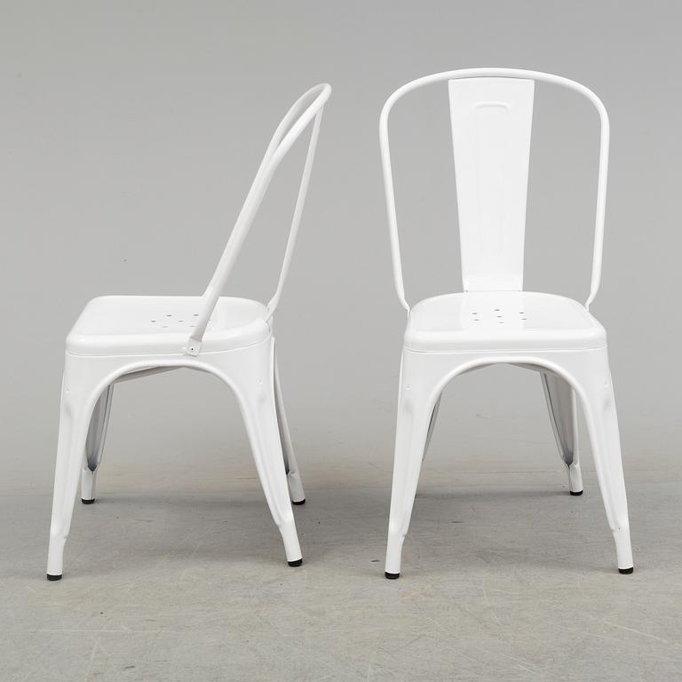 A set of four Tolix chairs.
