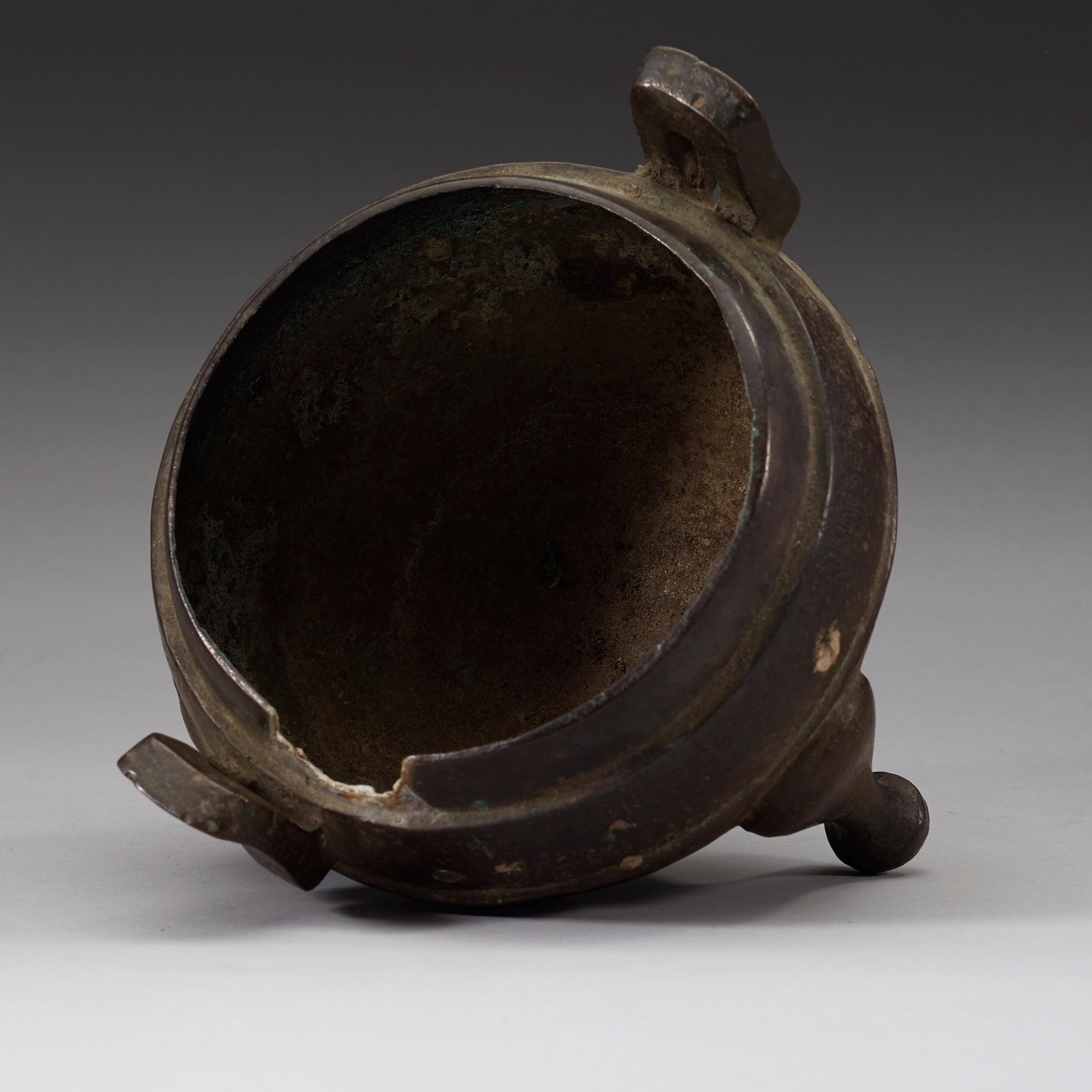 A bronze tripod censer, presumably Han dynasty (206 B.C-220 A.D).