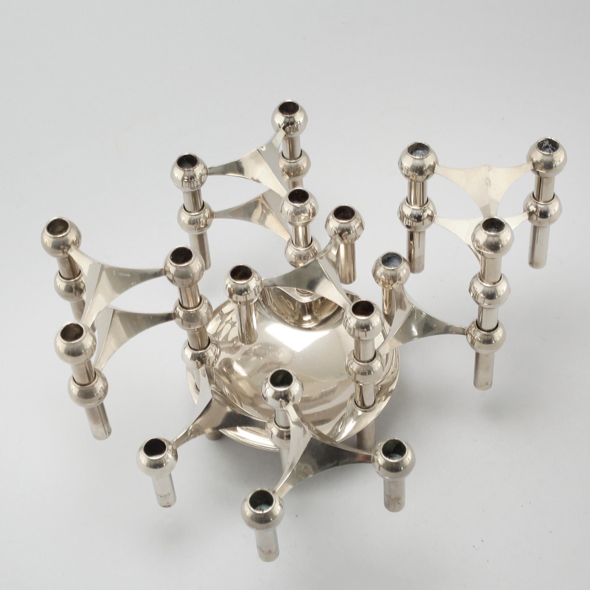 A metal candlestick with eleven parts by Ceasar Stoffi and Fritz Nagel, second half of the 20th century.