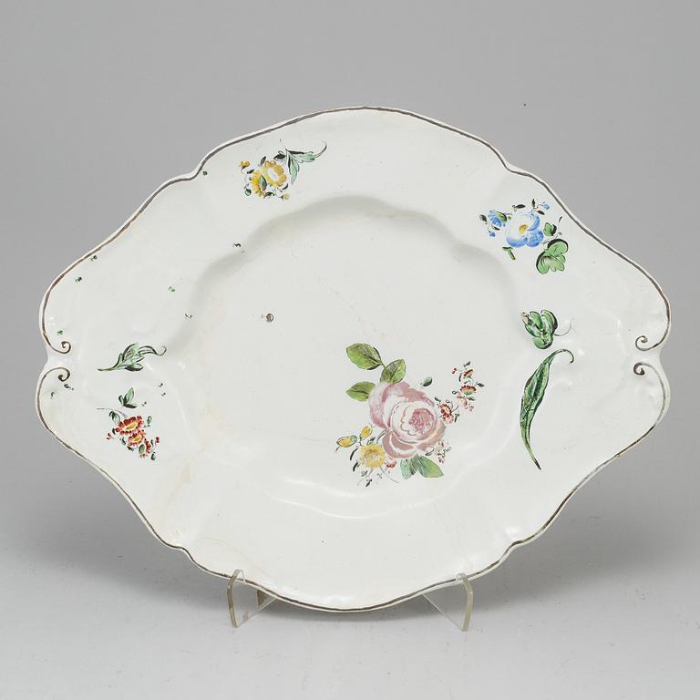 A German faience tureen stand marked B, 18th Century.