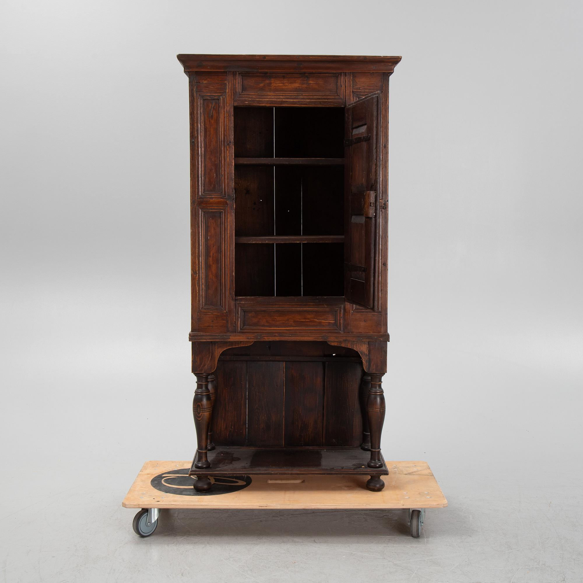 A Baroque cabinet on a later stand, early 18th Century.