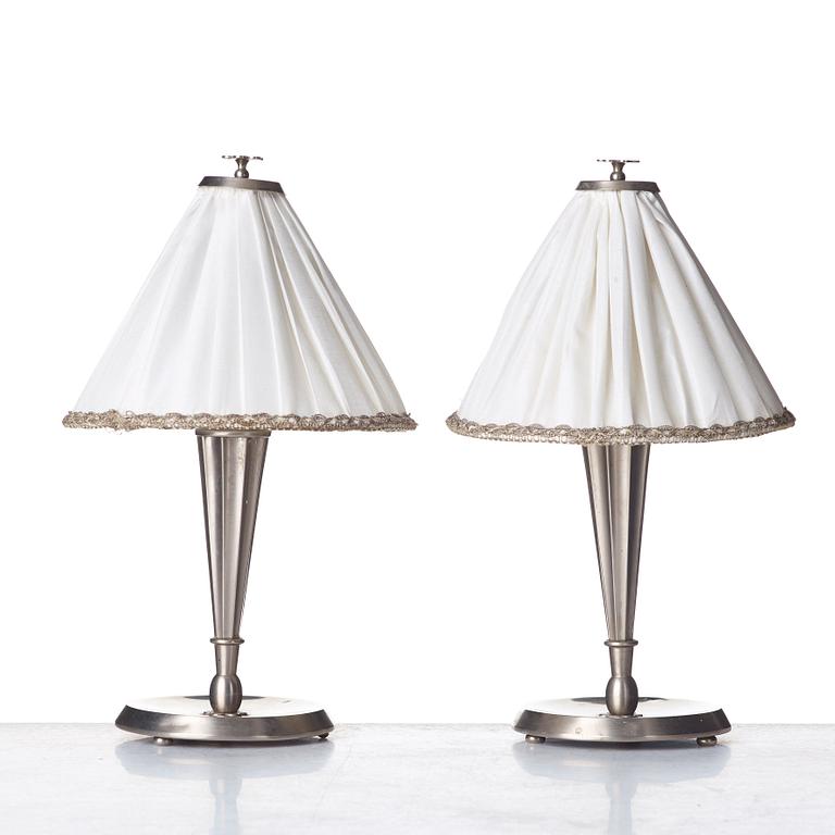 HARALD ELOF NOTINI, a pair of pewter table lamps by Böhlmarks, Stockholm 1920's-30's.